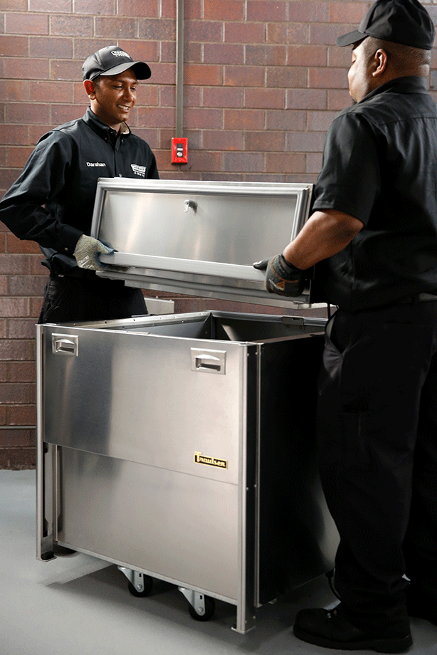 Hobart Service Technicians servicing Traulsen refrigerator